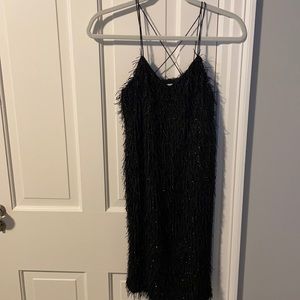 Black fringed mini dress.